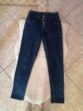 Jeans da donna skinny con bottoni colore blu scuro.