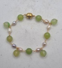 BRACCIALE A CHARMS con perle e