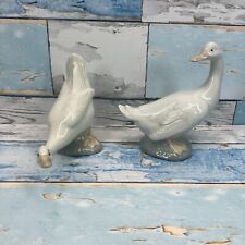 2 statuine Llandro Nao Goose (guardando indietro e preenando) Gesse