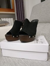 Zoccoli Mules con tacco alto