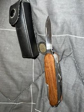 coltello multiuso con impugnatura in legno