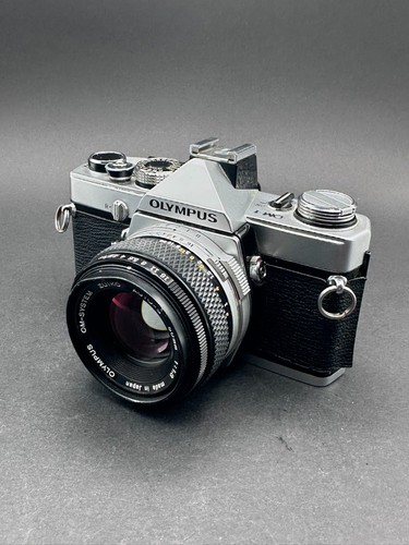 Olympus with - om-1,