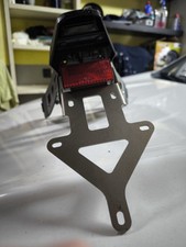 Porta targa sportivo acciaio PROMA Kymco AK 550, luce Illuminazione targhe led.