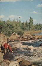 Man Fishing in Rushing River