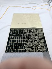 Sciarpa Estée Lauder nera e