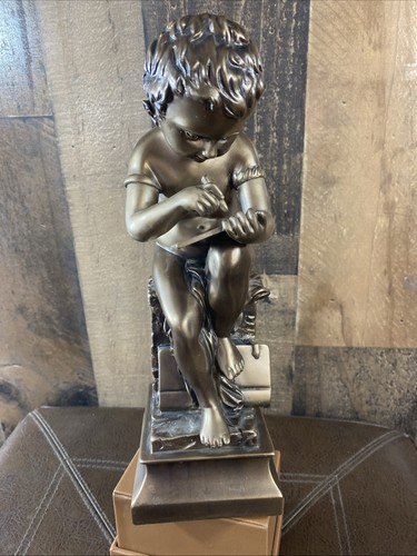 Scultura bronzo seduto - in,