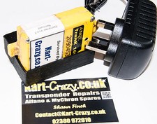 Caricabatteria e culla per