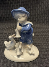 Statuina ragazzo con corno e 3