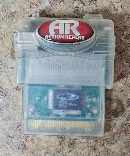 Action replay autentico - action,