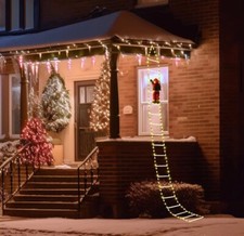 Babbo Natale su scala luminosa