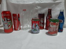 Bottigliette lattine Coca Cola vuote