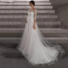 Abito da sposa in pizzo impero