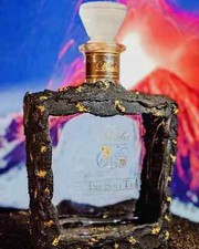 bottiglia di grappa antica berta CL 750 rivestita in pietra lavica dell'Etna 