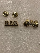 DISTINTIVO SIGLA G.P.G. COLORE ORO ATTACCO A CLIPS -