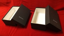 Gucci: 2 scatole vuote per scarpe, di colore nero. Logo Gucci in bianco. 
