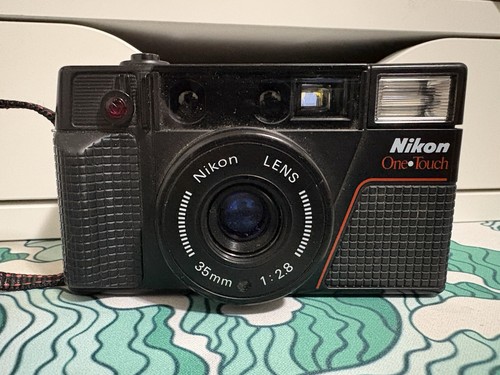 Nikon one touch testata - one,