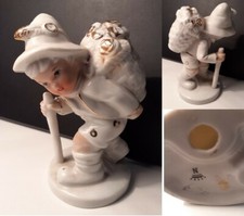 Statua Porcellana bianco oro con bimbo montanaro con gerla e bastone; Marchio N
