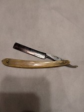 antico rasoio dritto con manico in corno trasparente