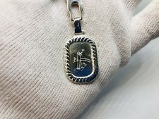 1 portachiavi ovale con simbolo Tiro al piattello, gare , incisioni Uomo 