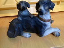 ceramic figurine of two dogs