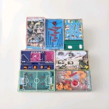 7 GIOCHI TASCABILI TOMY