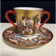 Tazza e piattino doppio manico
