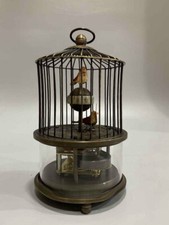 Vecchio antico orologio meccanico a gabbia per uccellini in rame fatto a mano