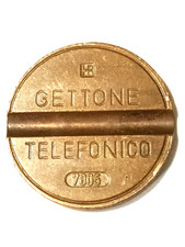 Gettone telefonico IPM 7805 NUMERI ALTI e tondello decentrato a sinistra