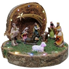Grotta su tronco di natale con