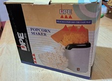 macchina per popcorn bianca con coperchio arancione. Non nuova ma mai usata. 