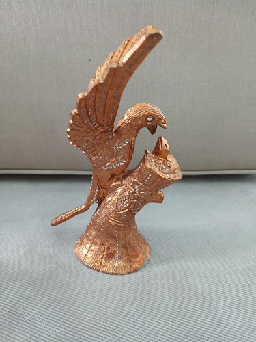Statua statuina pappagallo