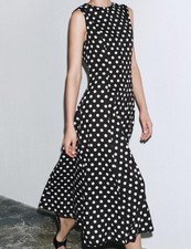 Abito midi smanicato a pois
