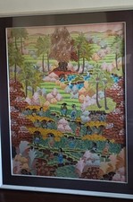 Quadro batik orientale toni caldi con scena di mercato della frutta e natura