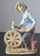 Statuina fabbro porcellana