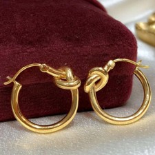 Orecchini a cerchio donna in oro giallo puro 18 kt con nodi portafortuna