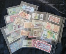 29 BANCONOTE dal MONDO raccolte in 9 fogli per album a 3 fori