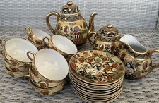 Set da tè cinese: 12 piattini, 12 tazzine,1 teiera e 2 altri accessori