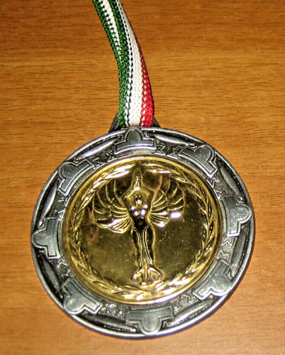 Medaglia metallo dorato - in,