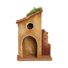 Casetta con muro di mattoni e