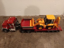 MODELLI BRUDER-RUSPA SU GOMMA/SCAVATRICE SU CINGOLI/CAMION RIBALTABILE(NO MACK!)