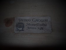 Vecchio violoncello con pinza