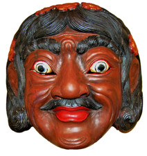 Maschera in legno intagliata a