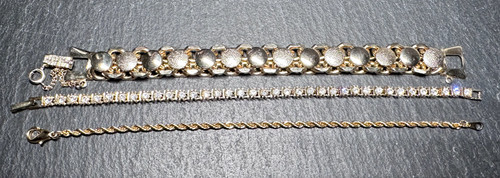 Tre bracciali tono oro tennis - tre,