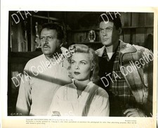 WOMAN AND TWO MEN LOOK OUT