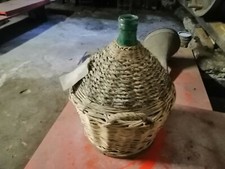 Serie di antiche damigiane impagliate in vetro soffiato  vintage