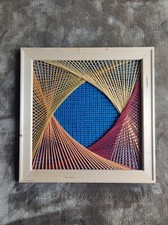 Quadro "Mandala intrecciato" in lana, realizzato in tecnica string art
