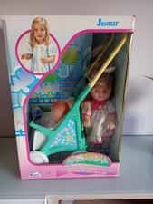 Bambola con grande passeggino