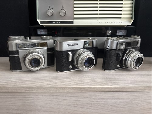 Tre macchine fotografiche - macchine,