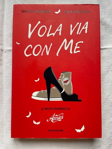 Vola via con - via, amici