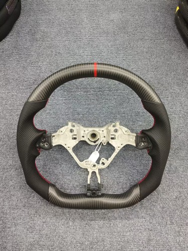 Volante vera fibra di - in,